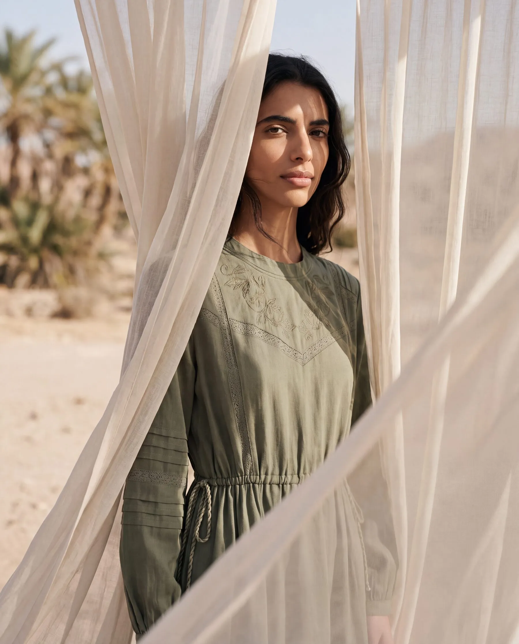 KINSHIP – olive dress between linen curtains