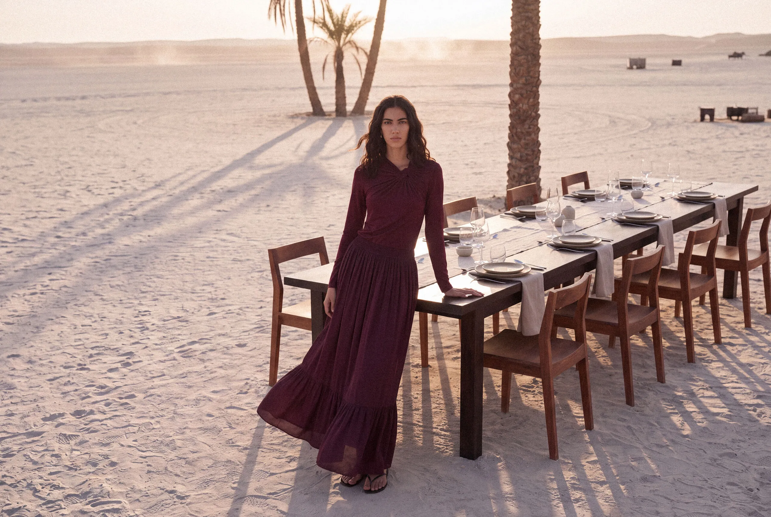 KINSHIP – burgundy dress beside a dining table
